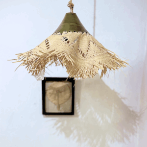 Handmade glazed ceramic lamp with karanday fiber, crafted by Paraguayan artisans.